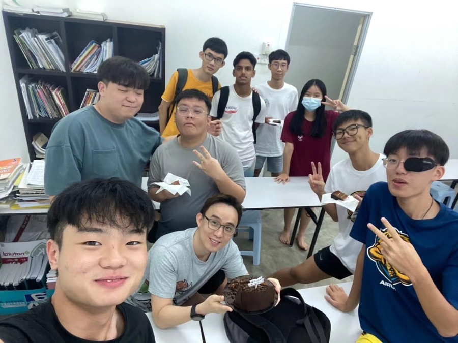 Mr Soon celebrating with a group of students